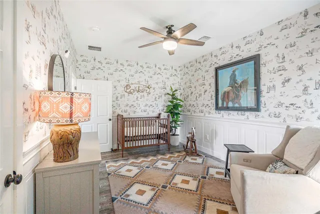 a bathroom with a granite countertop sink a toilet and shower