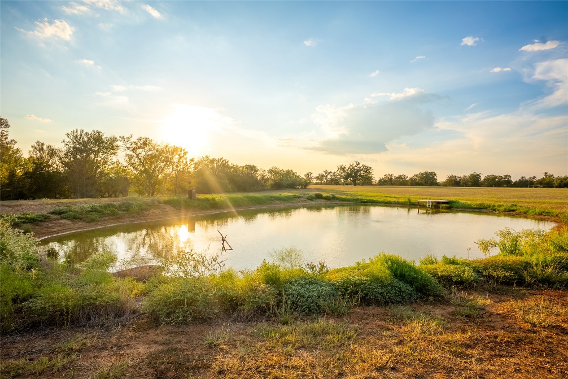 1000 Oil Field Road Lockhart, TX 78644 - Photo 25 of 39 a view of a lake in between two large trees