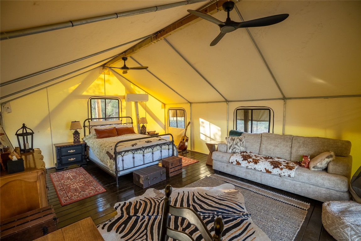1000 Oil Field Road Lockhart, TX 78644 - Photo 27 of 39 a bedroom with furniture and a window