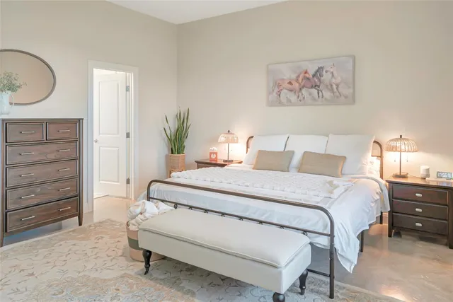 a hallway with a dining table and chairs