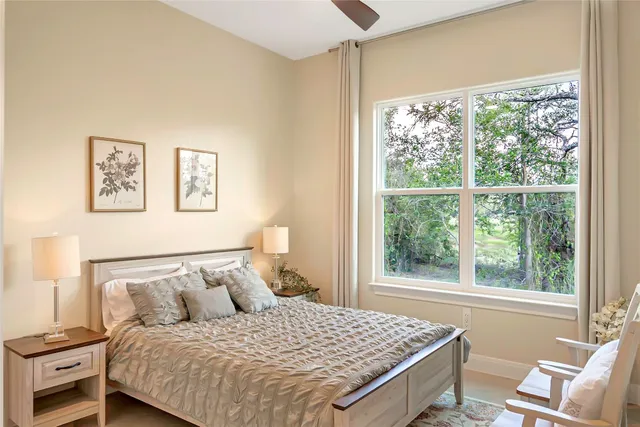 a bathroom with a granite countertop sink mirror toilet and bathtub