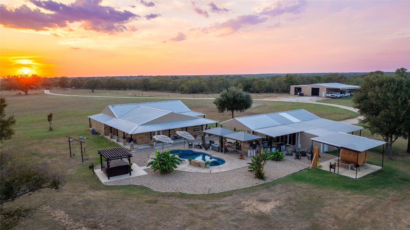 1000 Oil Field Road Lockhart, TX 78644 - Photo 4 of 39 a view of a house with pool and a yard