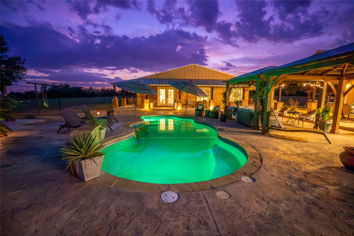 1000 Oil Field Road Lockhart, TX 78644 - Photo 9 of 39 a view of a swimming pool with a patio