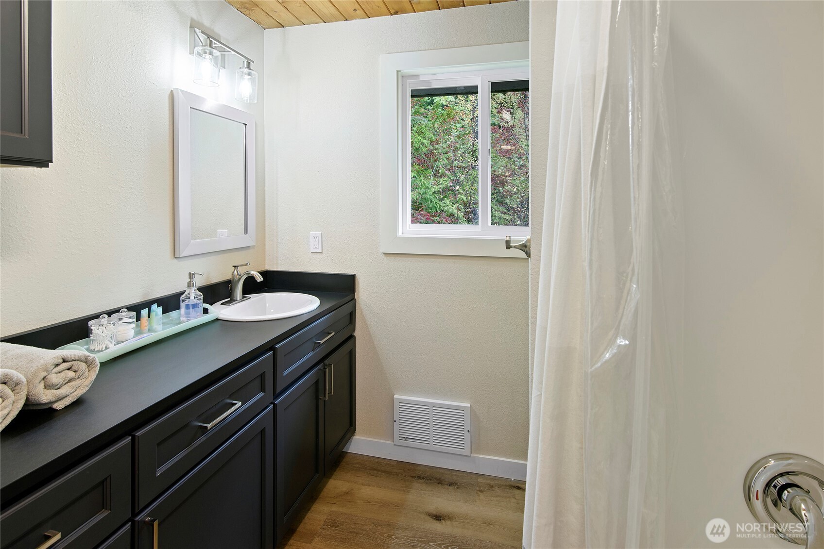 304292 Highway 101 Brinnon, WA 98320 - Photo 12 of 33 a bathroom with a sink and a mirror