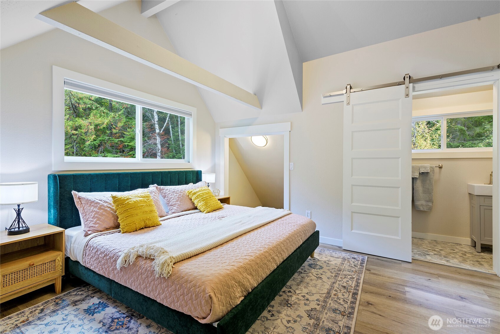 304292 Highway 101 Brinnon, WA 98320 - Photo 16 of 33 a bedroom with a bed and a dresser