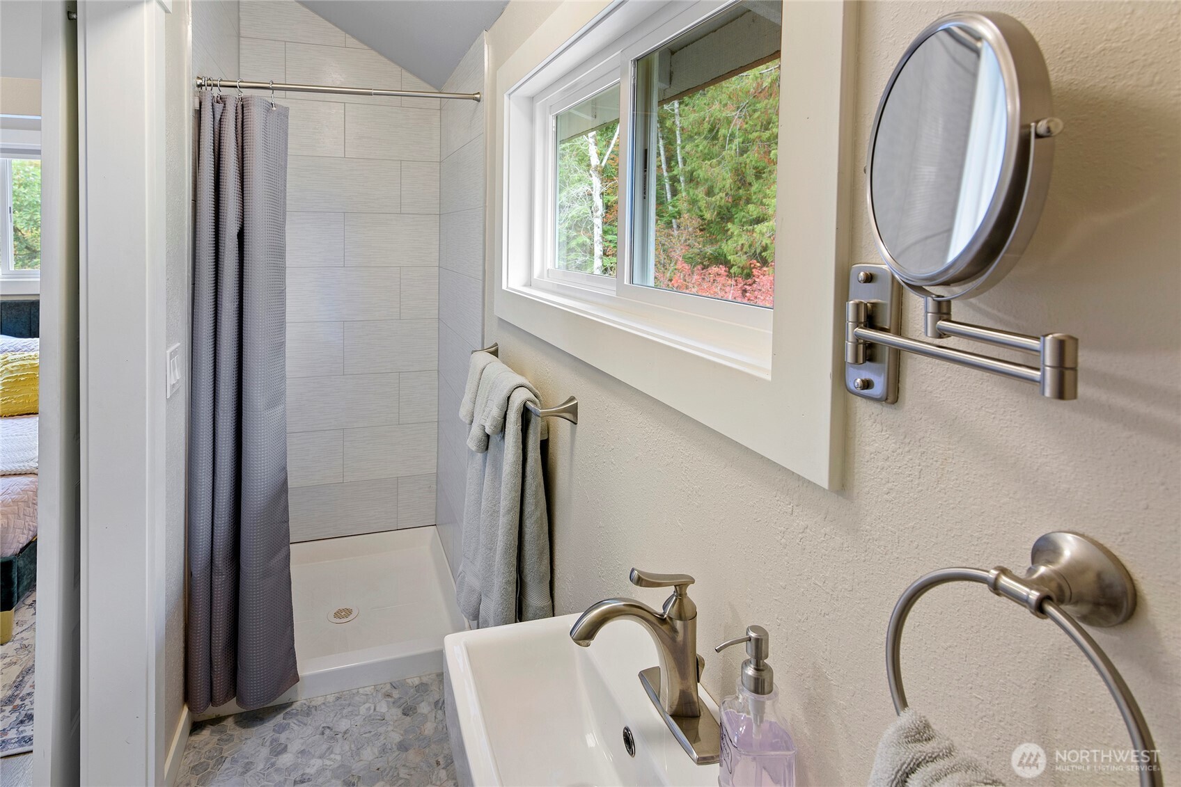 304292 Highway 101 Brinnon, WA 98320 - Photo 17 of 33 a bathroom with a sink and a mirror