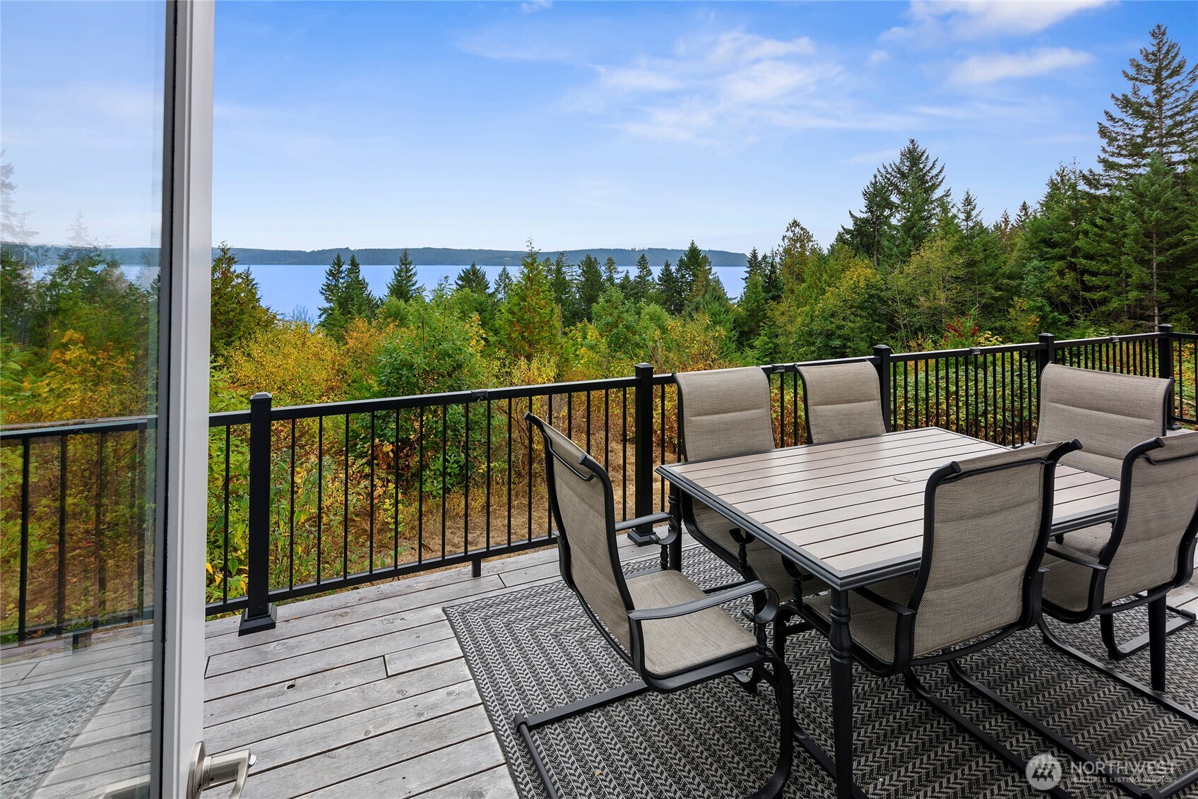 304292 Highway 101 Brinnon, WA 98320 - Photo 20 of 33 a view of a balcony with wooden floor and outdoor seating