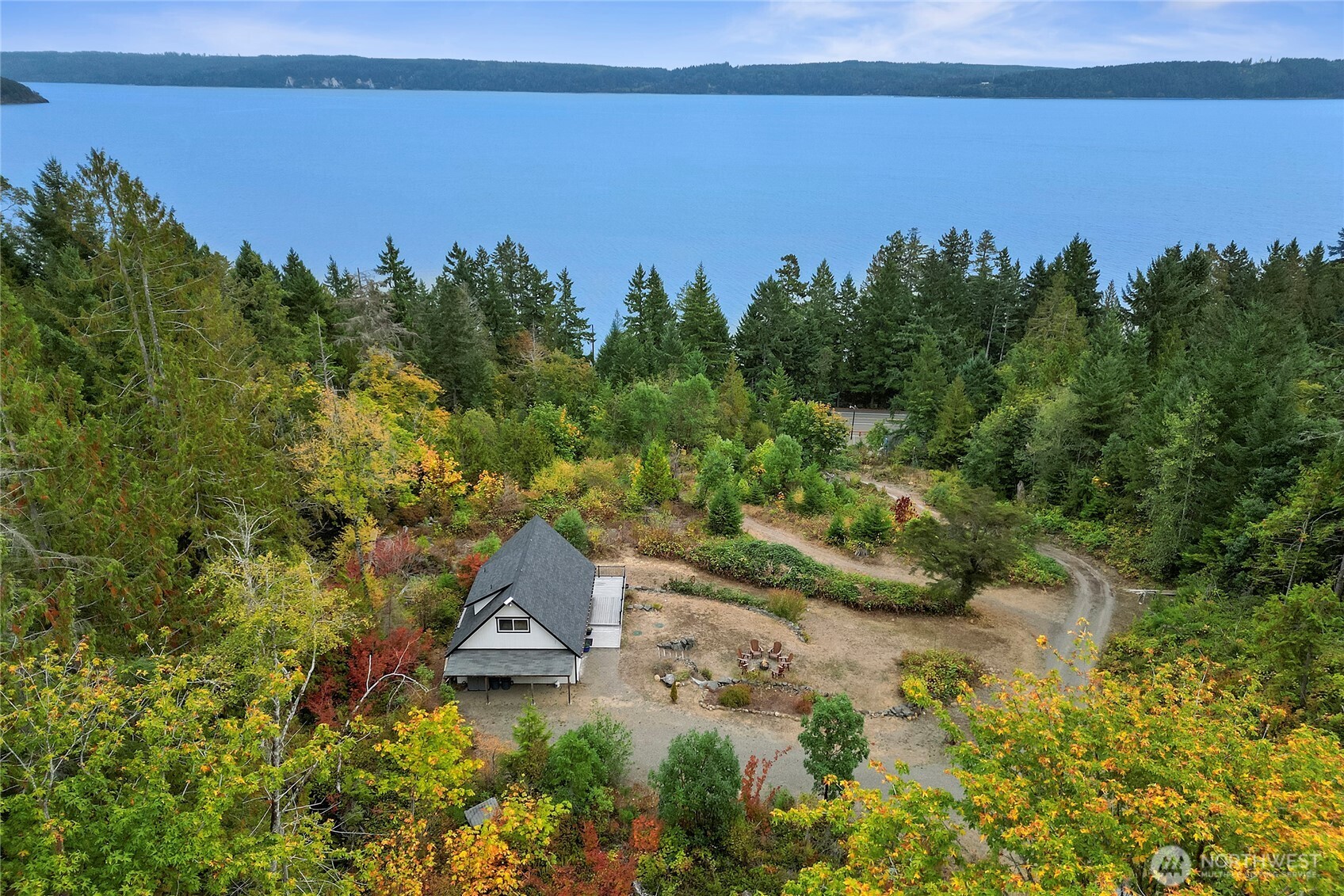 304292 Highway 101 Brinnon, WA 98320 - Photo 25 of 33 a view of a lake with houses in the back