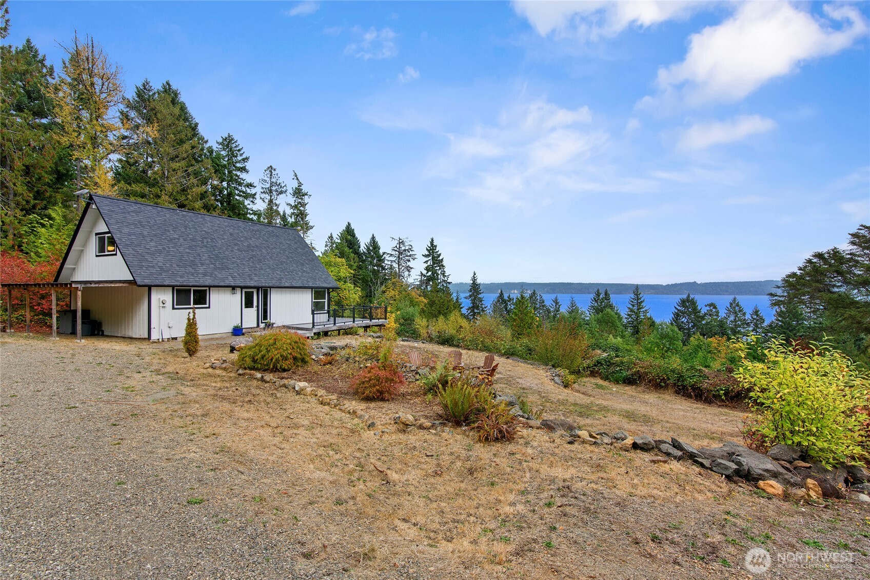 304292 Highway 101 Brinnon, WA 98320 - Photo 30 of 33 a view of a house with a yard covered in forest
