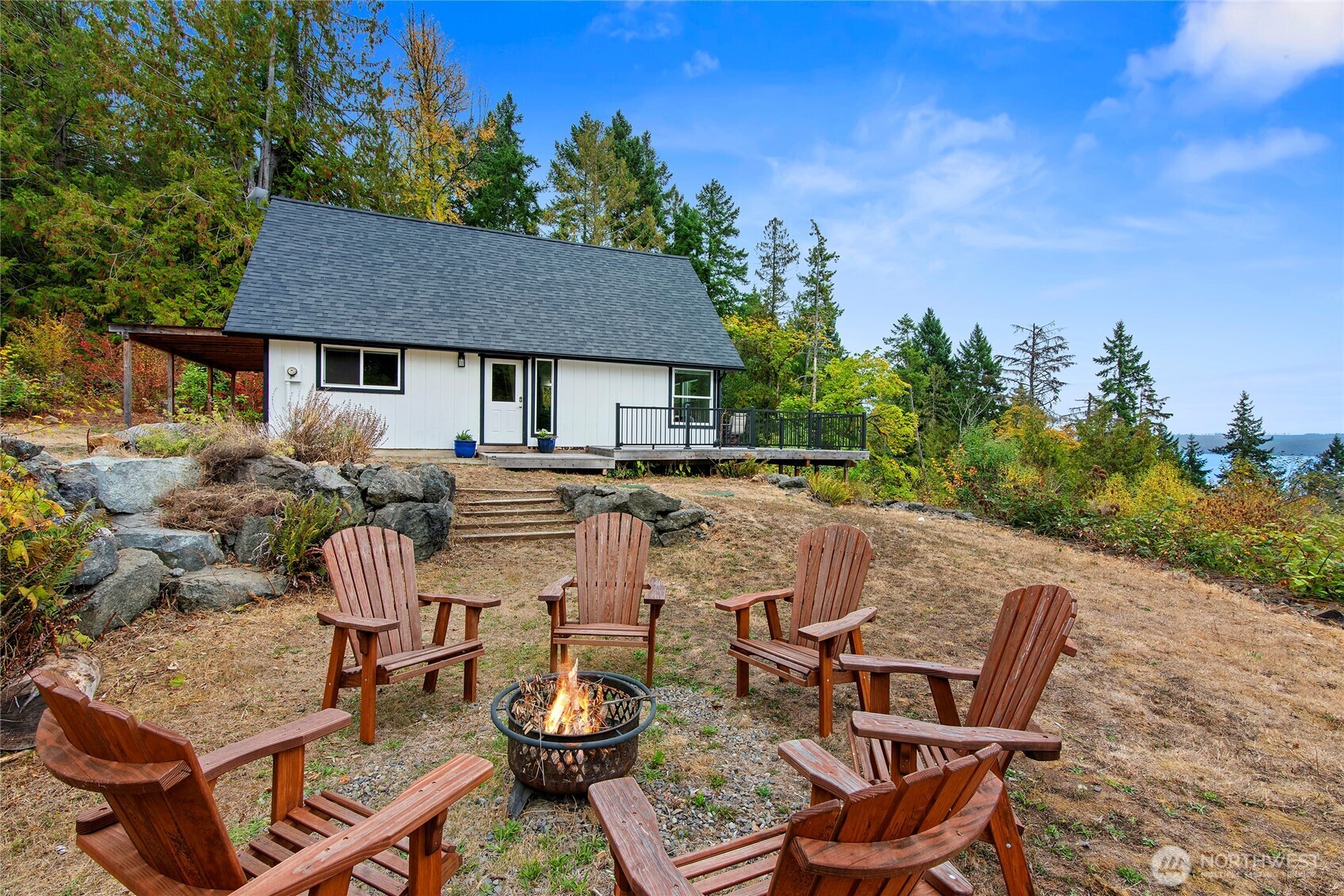 304292 Highway 101 Brinnon, WA 98320 - Photo 3 of 33 a view of a patio with table and chairs and potted plants