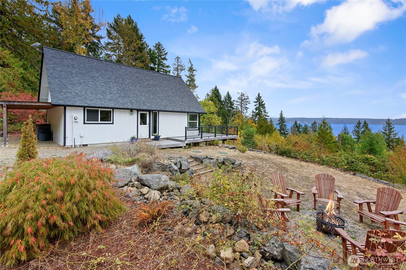 304292 Highway 101 Brinnon, WA 98320 - Photo 31 of 33 a view of a house with a yard