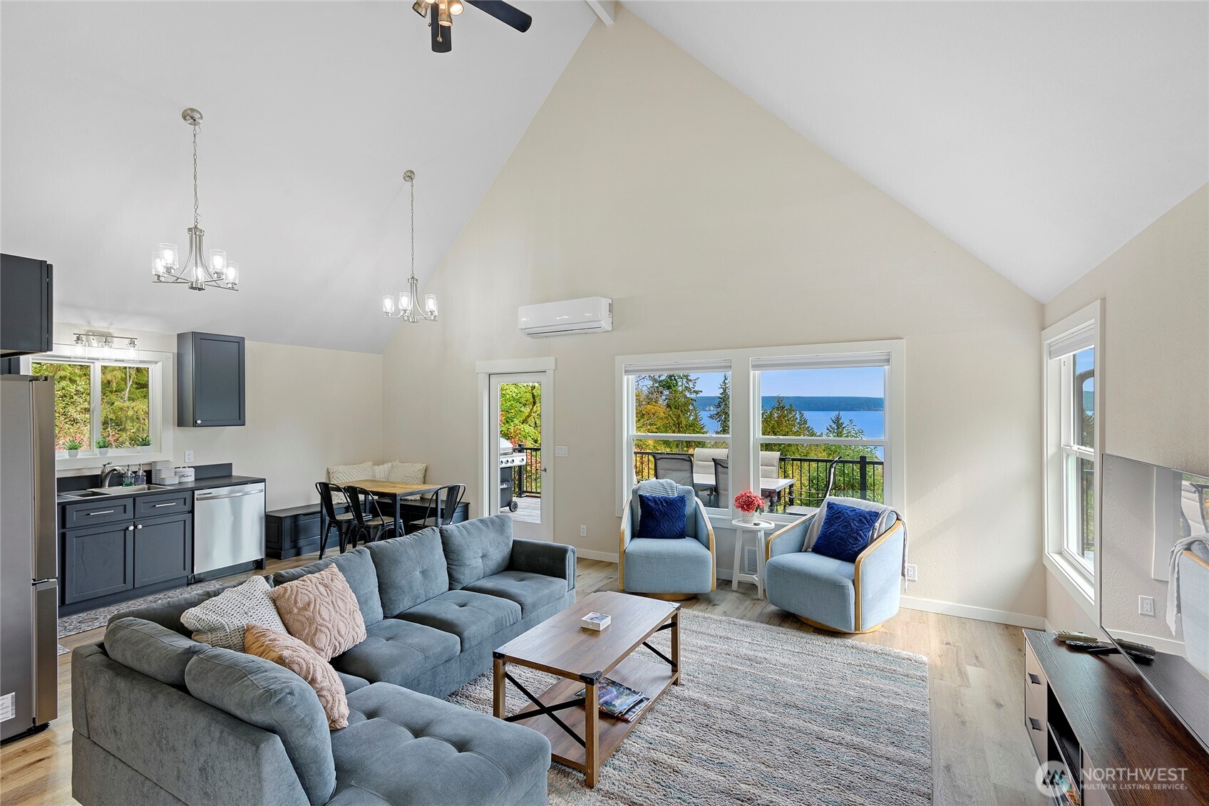 304292 Highway 101 Brinnon, WA 98320 - Photo 5 of 33 a living room with furniture and a large window