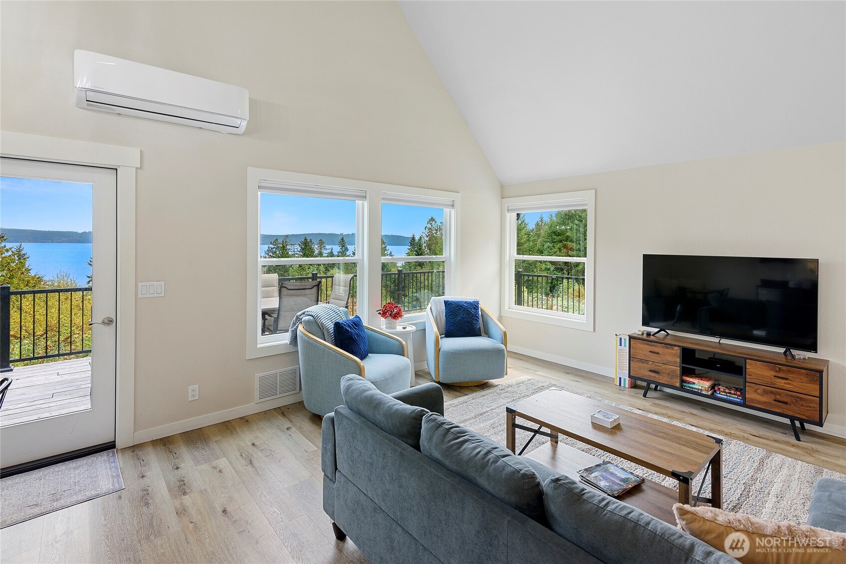304292 Highway 101 Brinnon, WA 98320 - Photo 8 of 33 a living room with furniture and a flat screen tv
