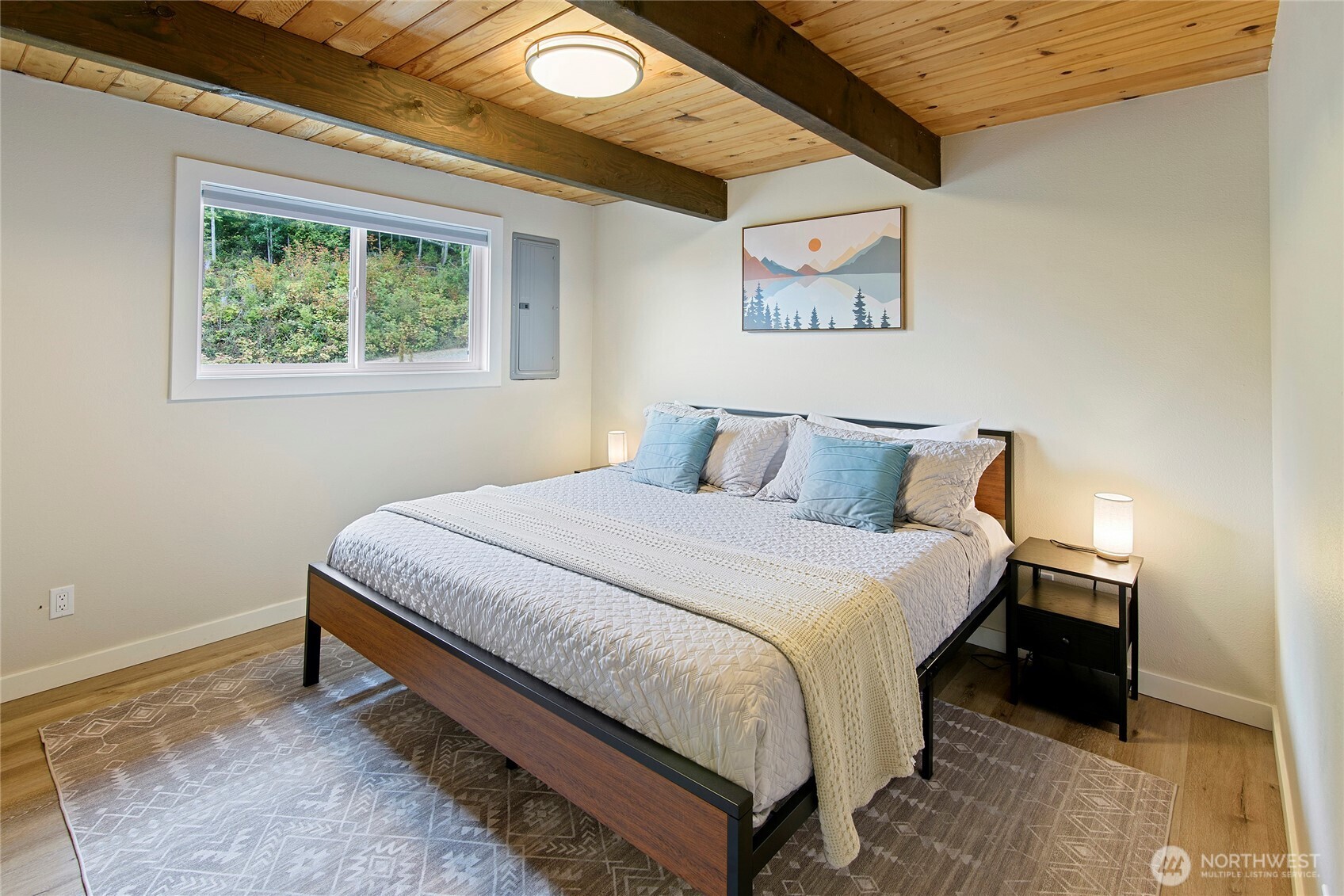 304292 Highway 101 Brinnon, WA 98320 - Photo 10 of 33 a bedroom with a bed and a window