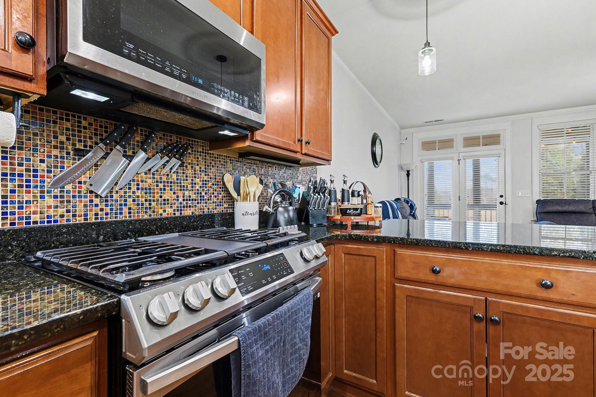 797 Herrons Ferry Road Rock Hill, SC 29730 - Photo 13 of 34 a kitchen with granite countertop a stove and a sink