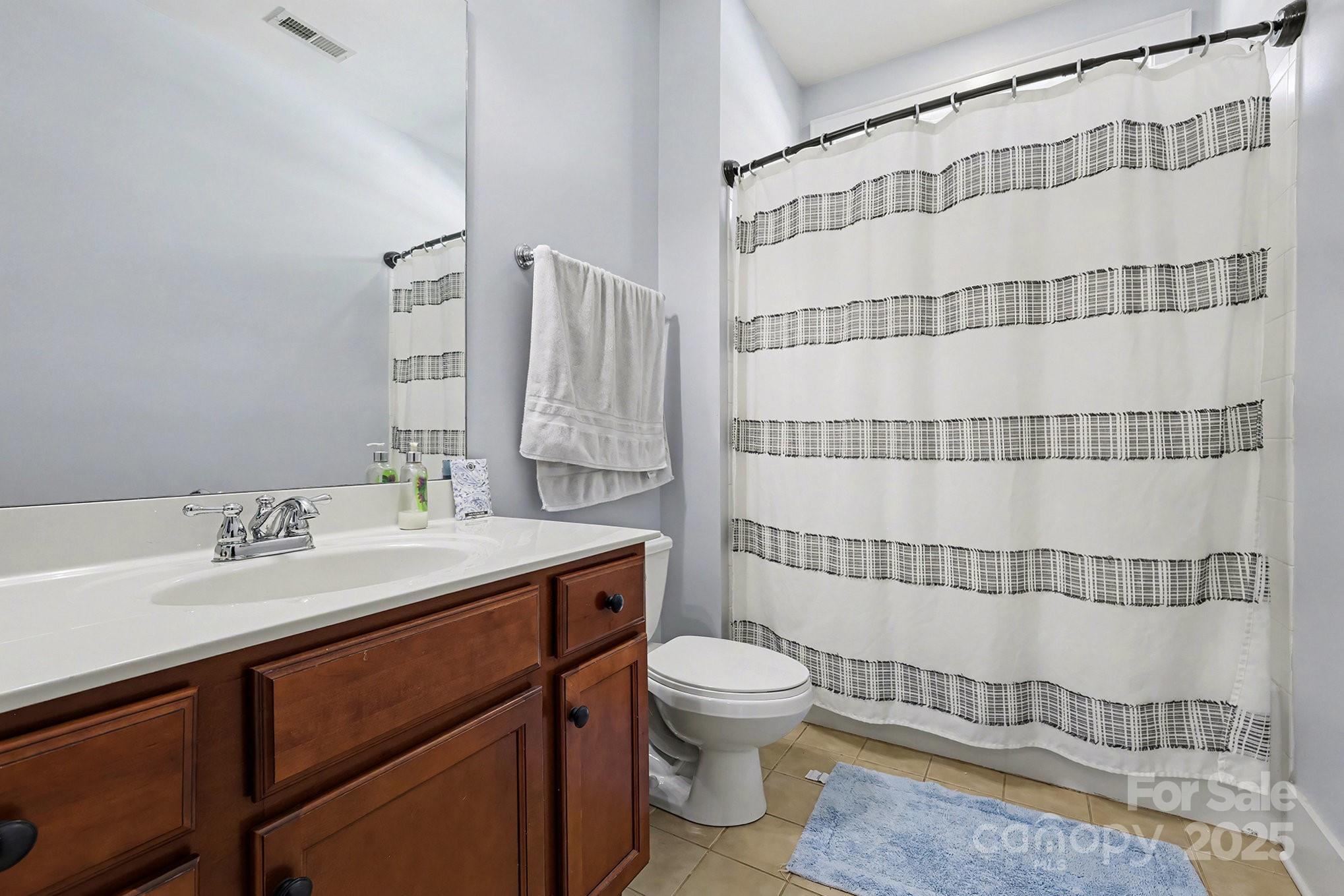 797 Herrons Ferry Road Rock Hill, SC 29730 - Photo 14 of 34 a bathroom with a sink toilet and shower