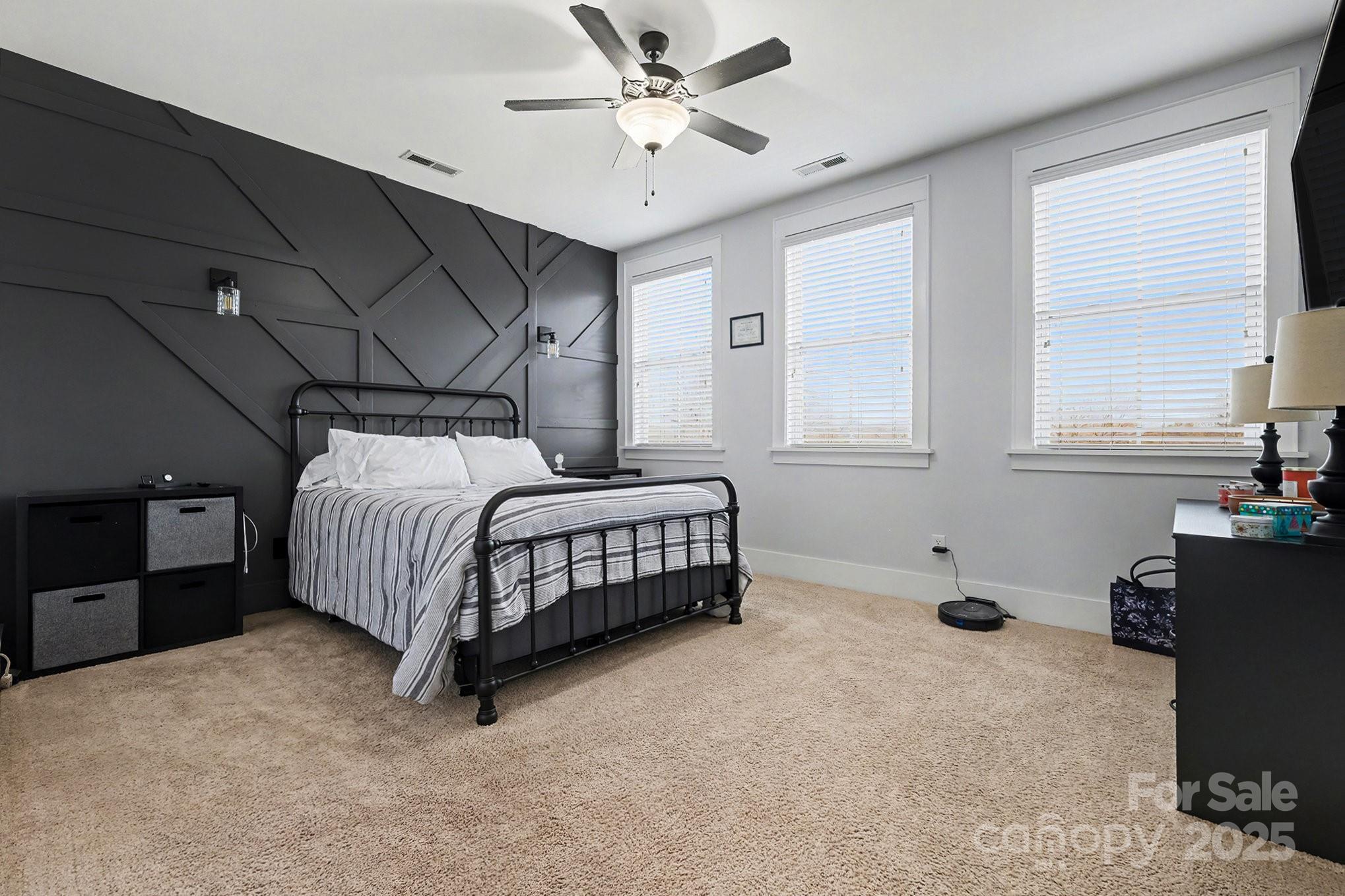 797 Herrons Ferry Road Rock Hill, SC 29730 - Photo 16 of 34 a bedroom with a bed and a chandelier fan