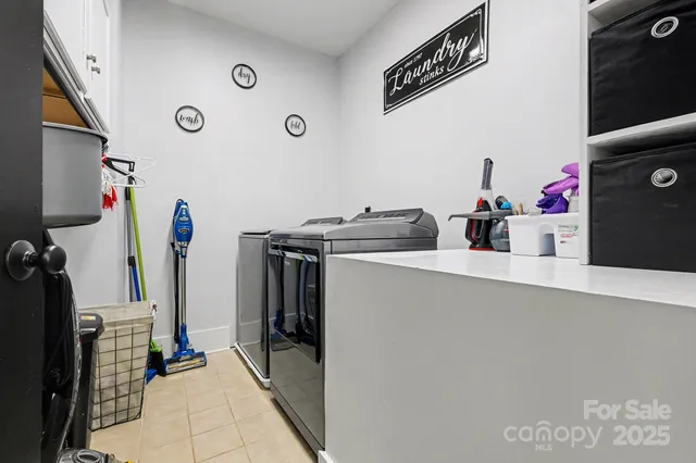 a view of a storage & utility room with washer and dryer