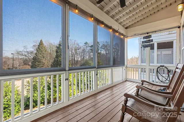 a view of a balcony with chairs