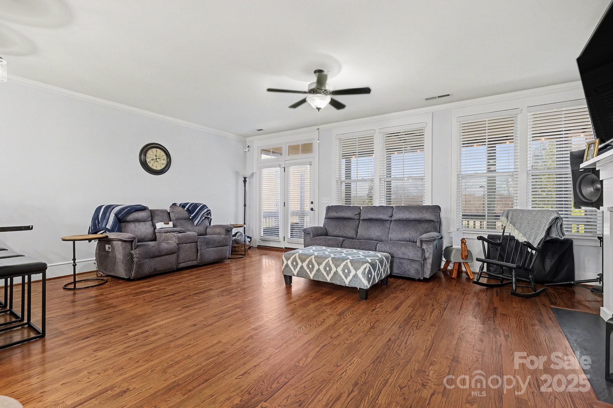 797 Herrons Ferry Road Rock Hill, SC 29730 - Photo 8 of 34 a living room with furniture and a wooden floor