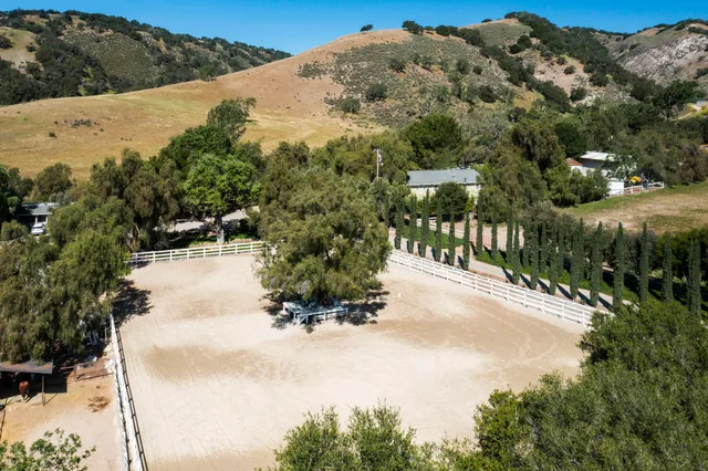 a view of a road with a building in the background