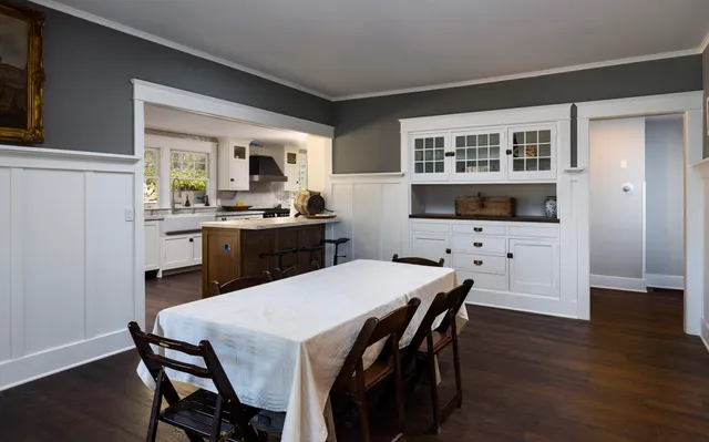 a large bed sitting in a bedroom next to a window