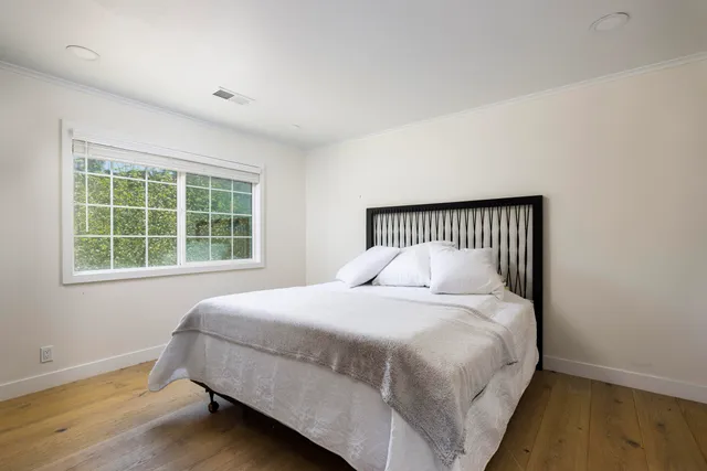 a bathroom with a double vanity sink mirror and shower