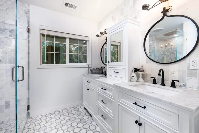 a view of house with backyard and sitting area