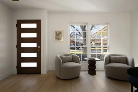 a living room with furniture and windows