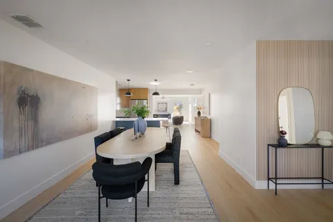a view of a livingroom with furniture and a potted plant