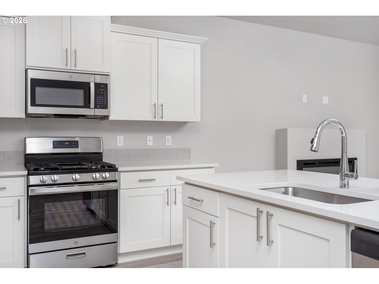 2892 South Ivy Street, Unit LOT 847 Cornelius, OR 97113 - Photo 16 of 24 a kitchen with cabinets stainless steel appliances and a sink