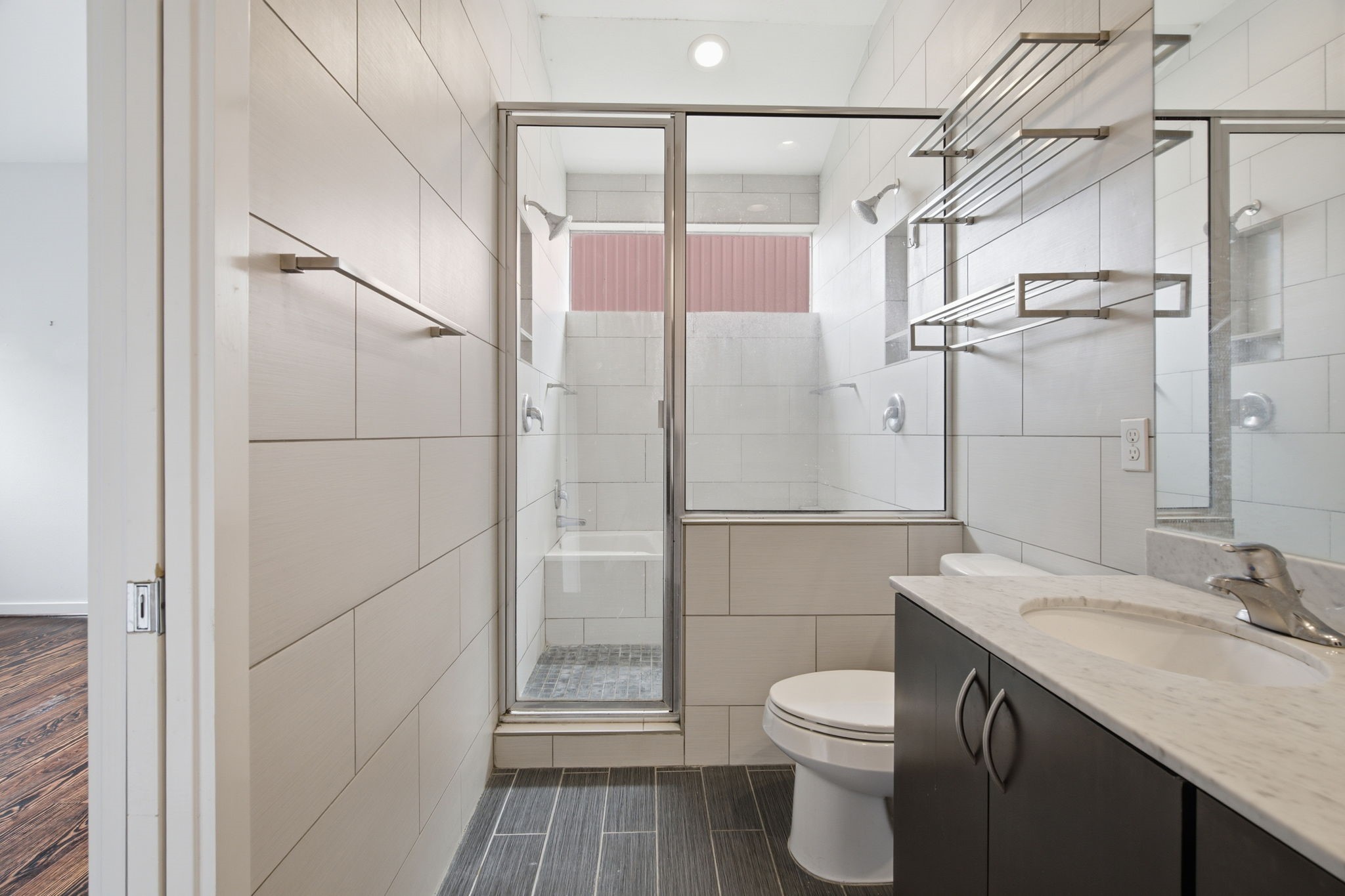 2934 Commerce Street Houston, TX 77003 - Photo 22 of 44 a bathroom with a granite countertop sink toilet and shower