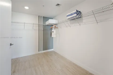 a view of a city from a balcony with furniture