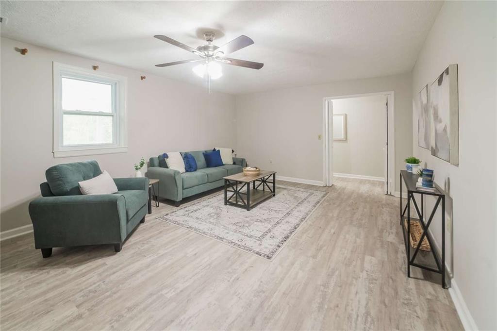 658 Agan Road Bremen, GA 30110 - Photo 3 of 15 a bedroom with furniture and a wooden floor