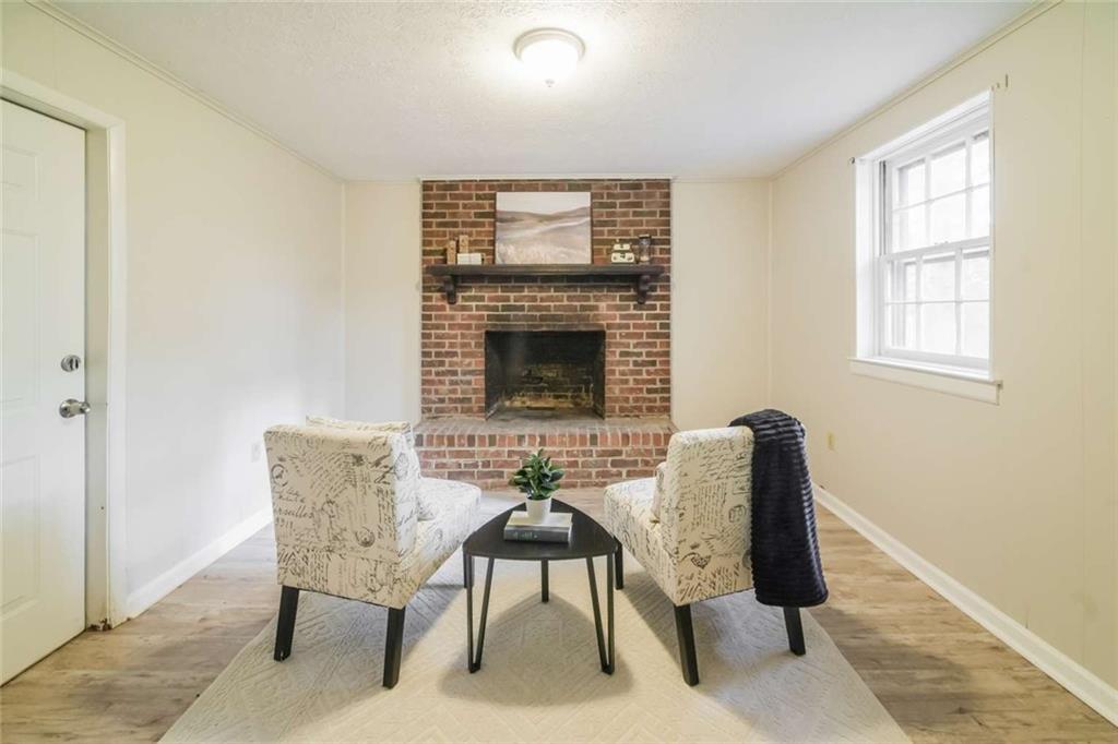 658 Agan Road Bremen, GA 30110 - Photo 7 of 15 a living room with furniture and a fireplace