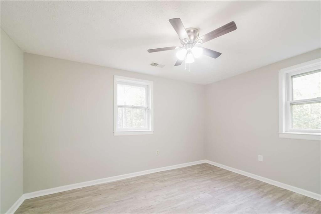 658 Agan Road Bremen, GA 30110 - Photo 10 of 15 an empty room with window and ceiling fan
