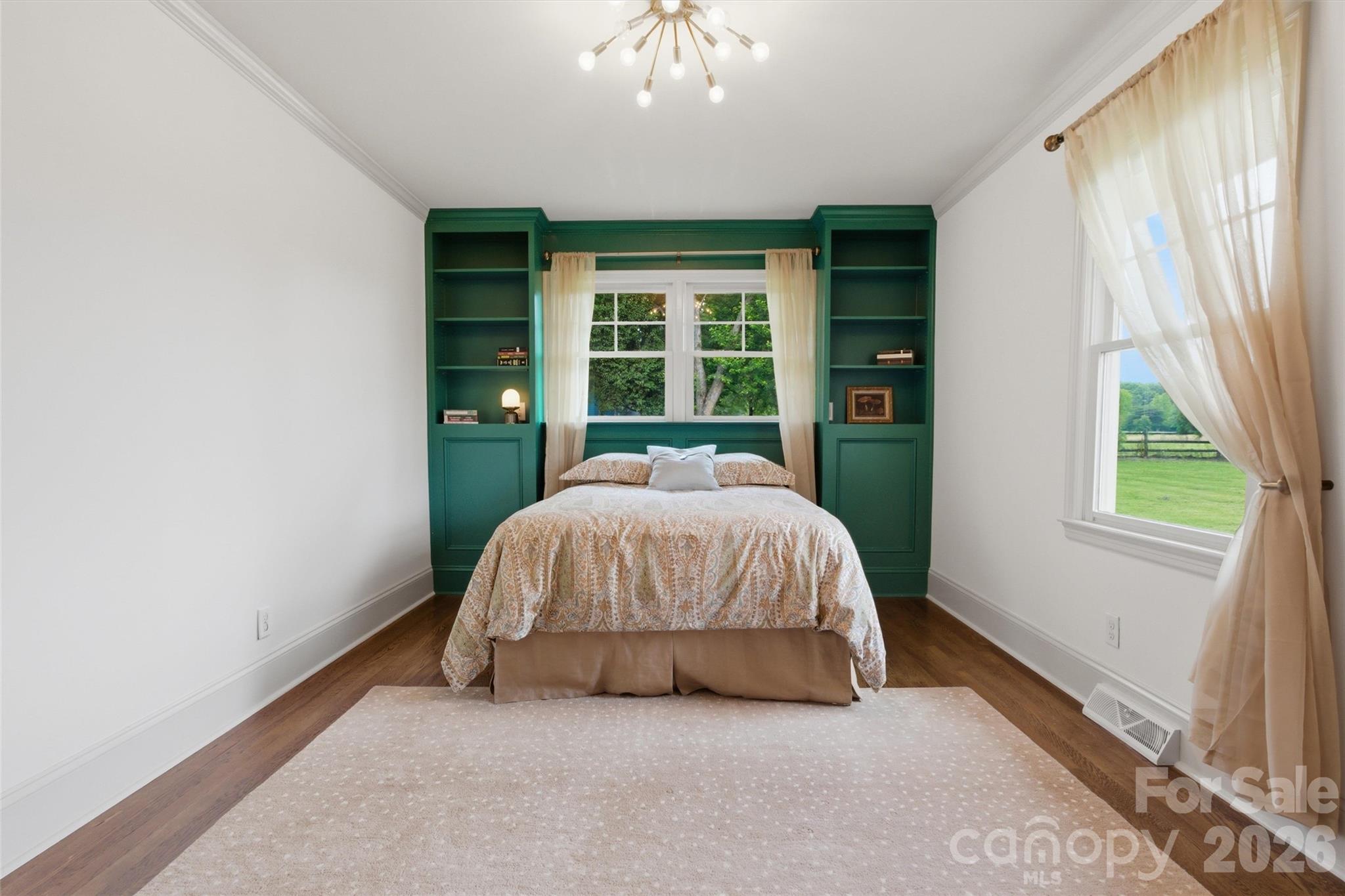 4712 Secrest Short Cut Road Monroe, NC 28110 - Photo 18 of 30 a bed room with a bed and a large window