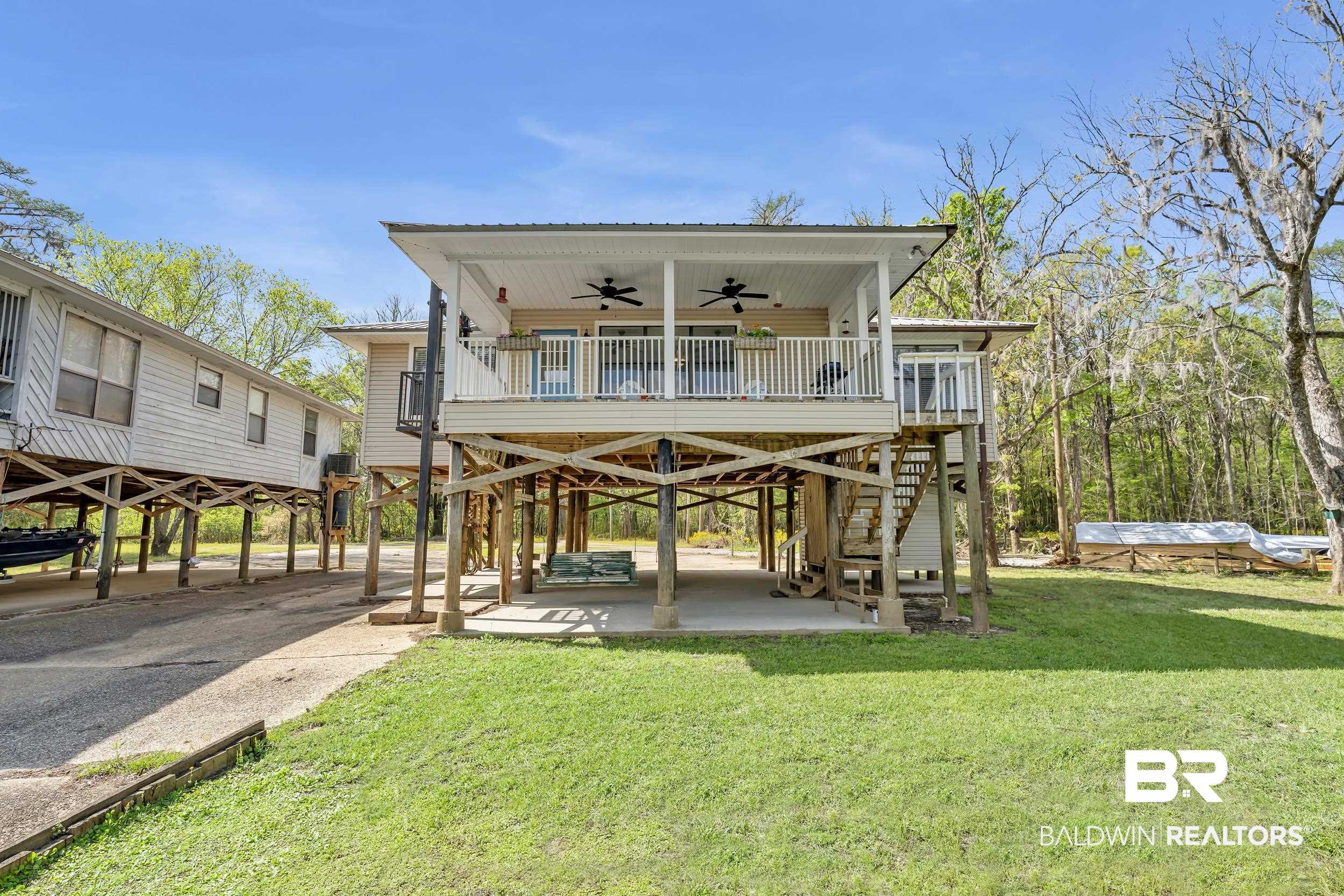 8081 Bryant's Lndg Road Stockton, AL 36579 - Photo 5 of 48 View of community featuring a patio and a deck