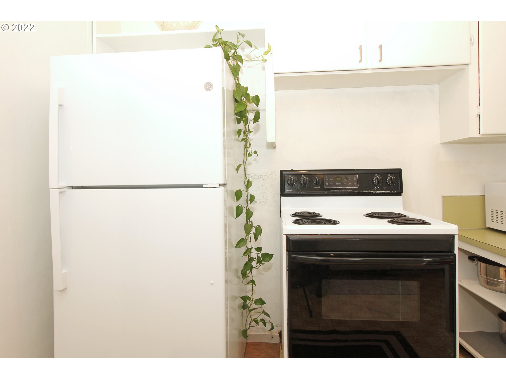 1939 E Street Springfield, OR 97477 - Photo 11 of 32 a kitchen with a stove and a refrigerator