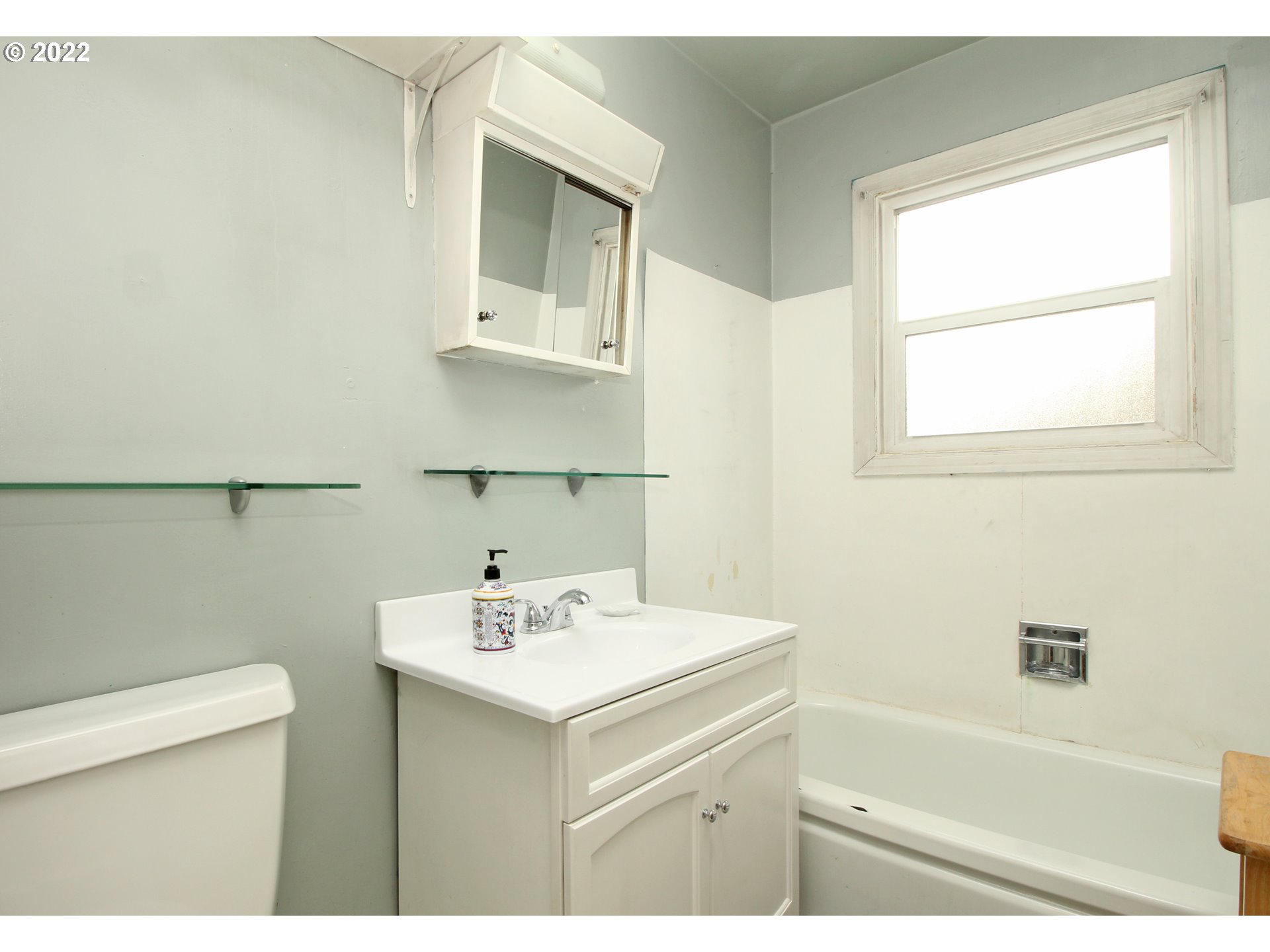 1939 E Street Springfield, OR 97477 - Photo 17 of 32 a bathroom with a sink a toilet and vanity