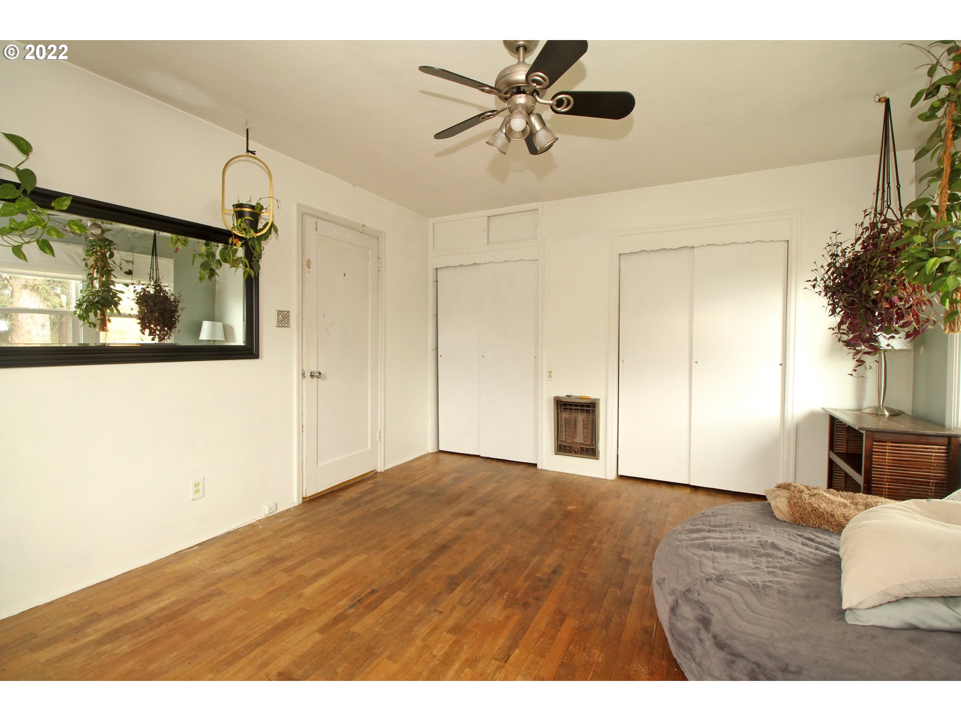 1939 E Street Springfield, OR 97477 - Photo 20 of 32 a view of empty room with wooden floor and fan