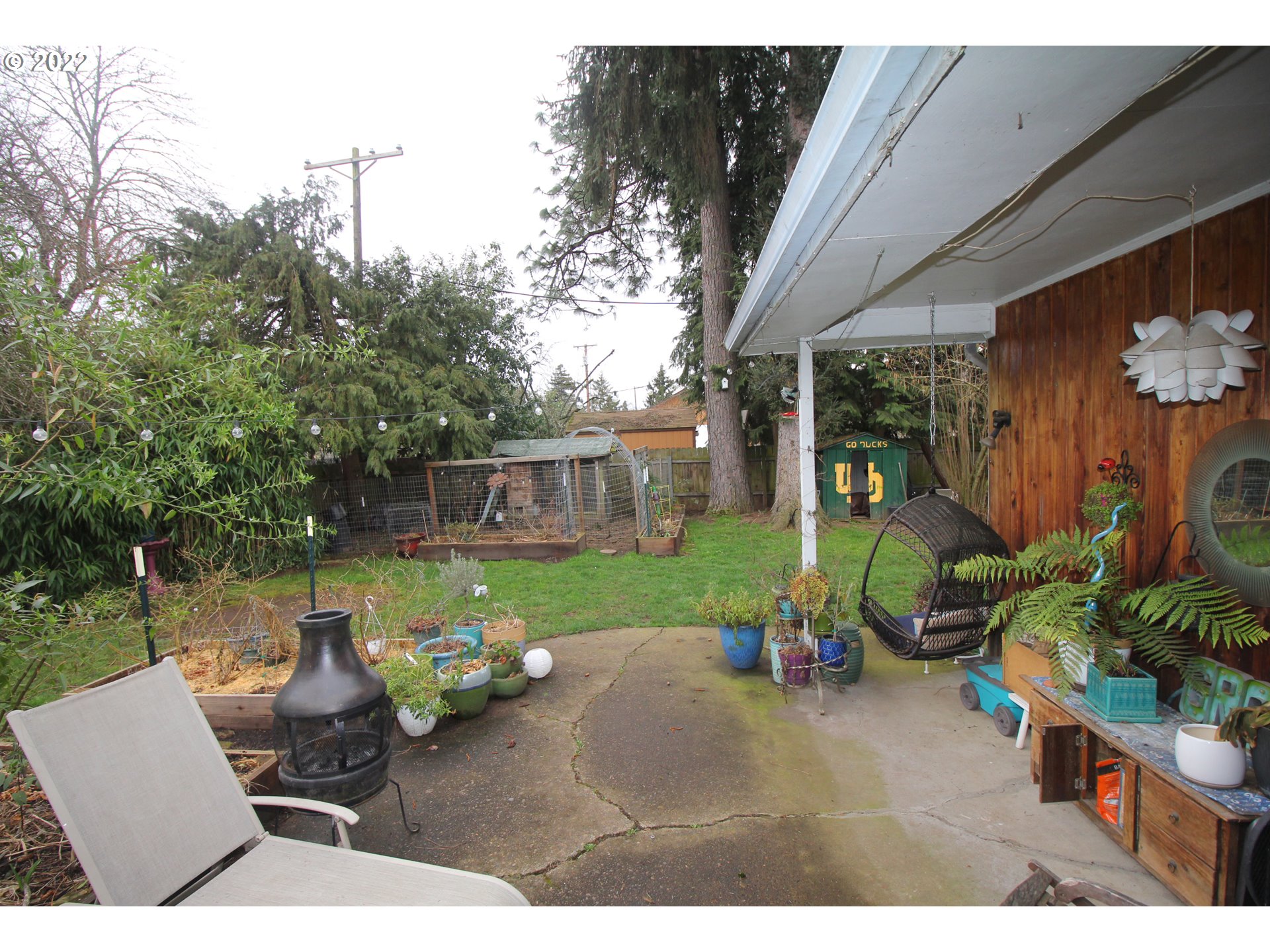 1939 E Street Springfield, OR 97477 - Photo 24 of 32 a backyard of a house with barbeque oven table and chairs
