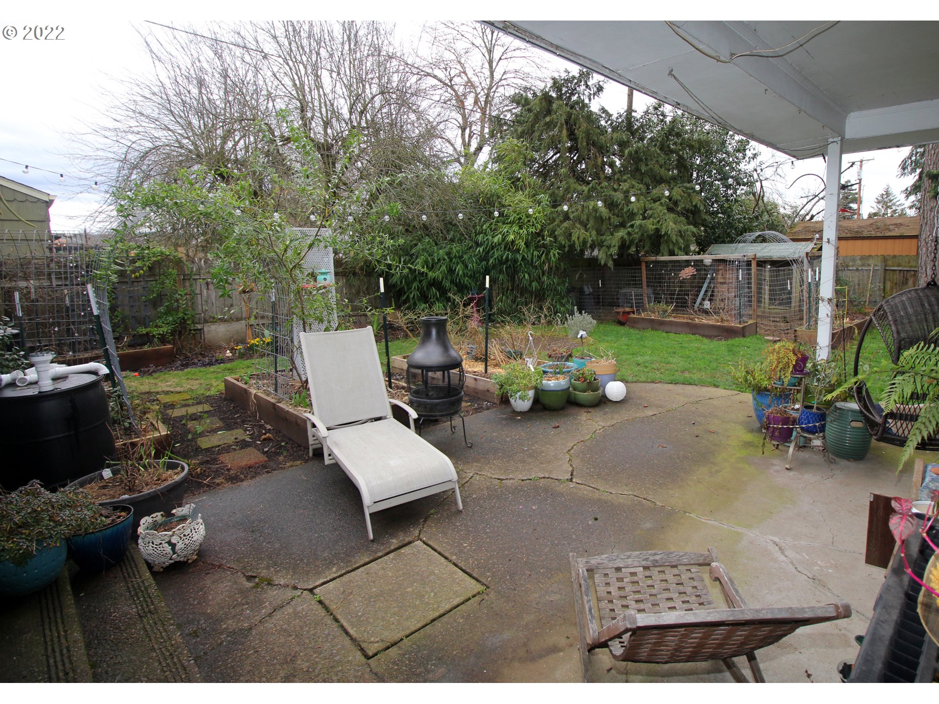 1939 E Street Springfield, OR 97477 - Photo 26 of 32 a view of backyard with outdoor seating and trees