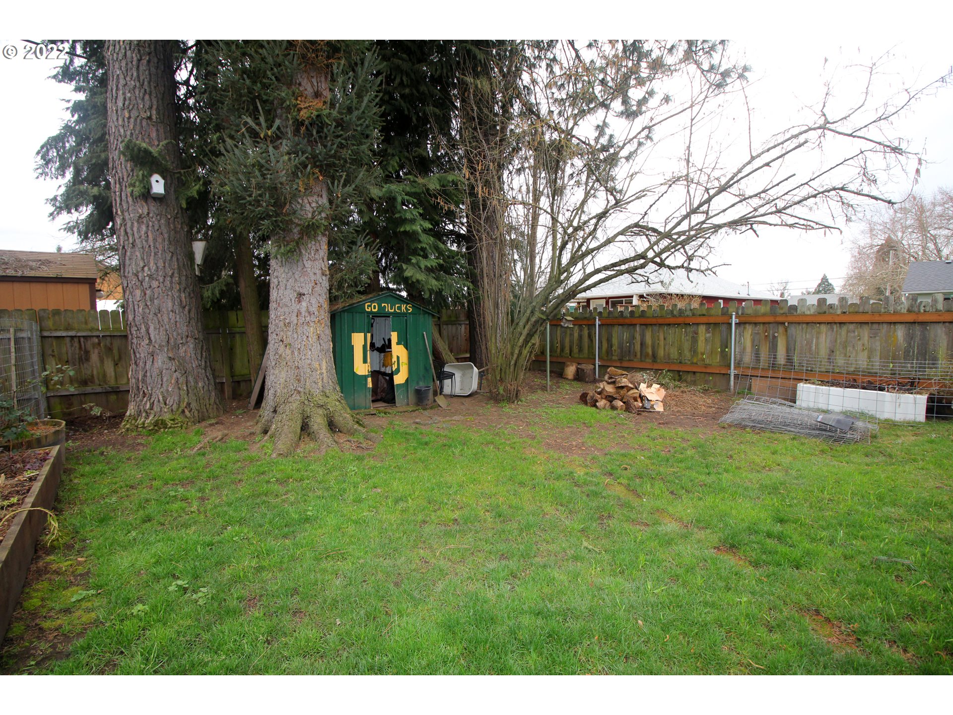 1939 E Street Springfield, OR 97477 - Photo 29 of 32 a view of a park with swings and a large tree