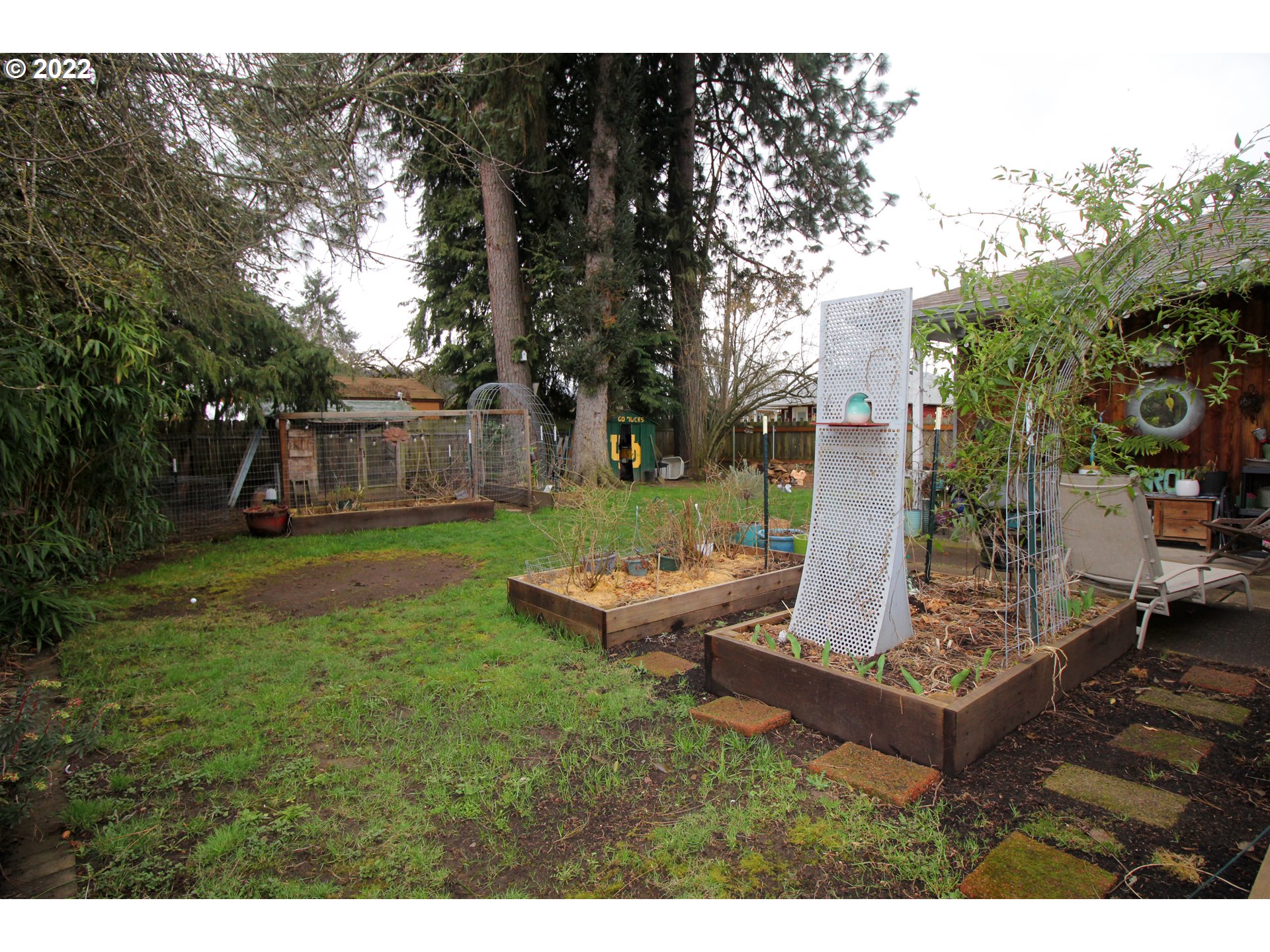 1939 E Street Springfield, OR 97477 - Photo 30 of 32 a view of a backyard with plants and outdoor seating