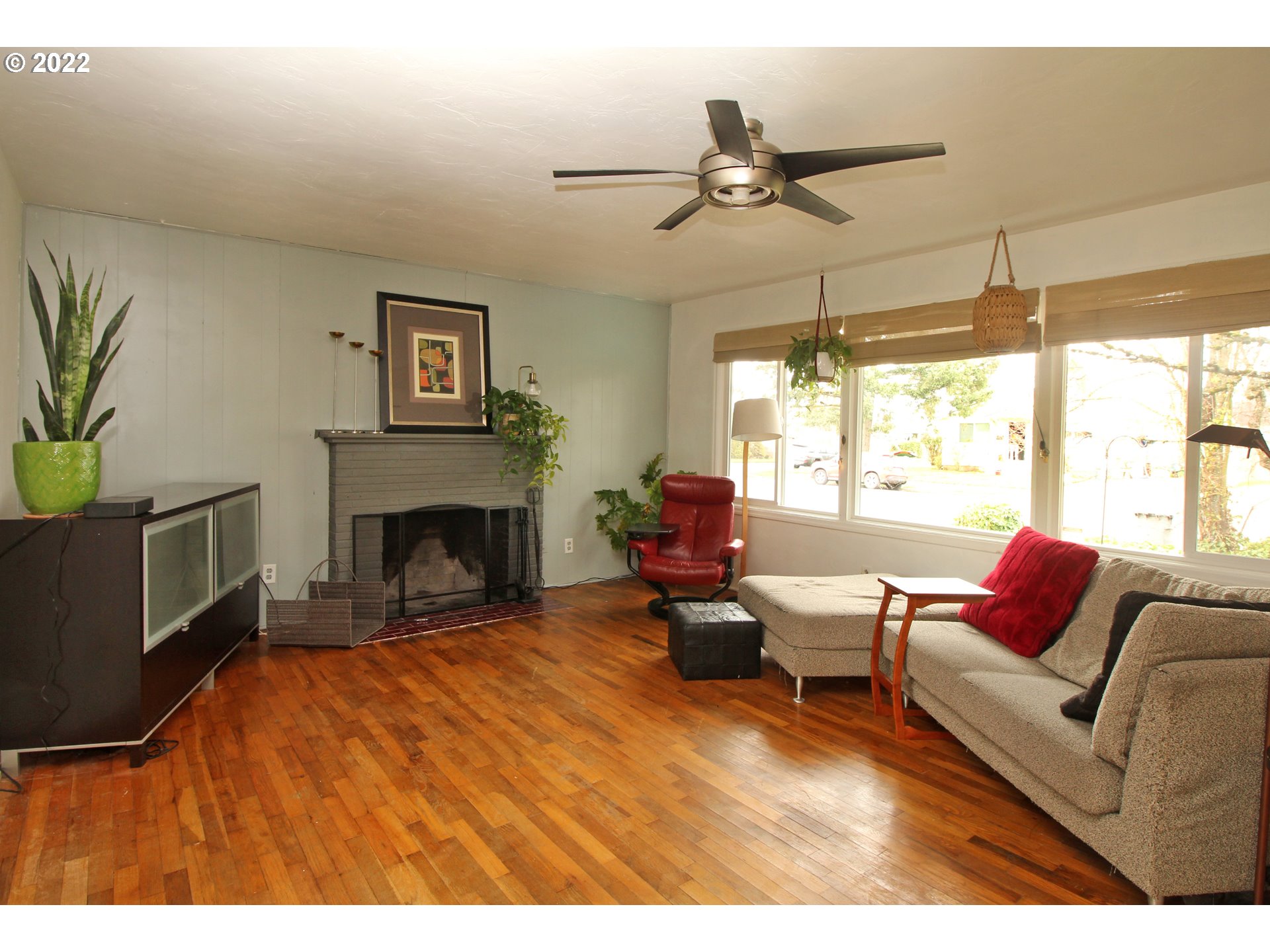 1939 E Street Springfield, OR 97477 - Photo 6 of 32 a living room with furniture a window and a fireplace