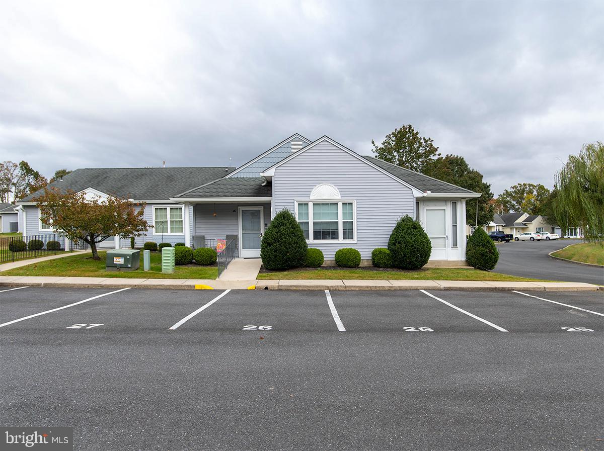 2000 Miller Avenue, Unit 26 Millville, NJ 08332 - Photo 1 of 25 a view of a white house with a large windows and palm trees