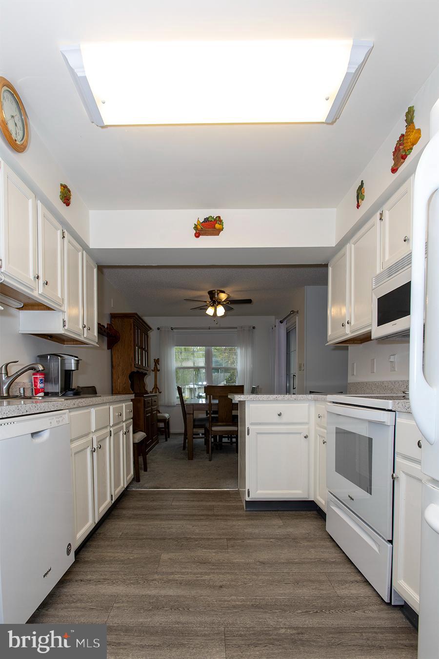 2000 Miller Avenue, Unit 26 Millville, NJ 08332 - Photo 16 of 25 a kitchen with stainless steel appliances a stove top oven