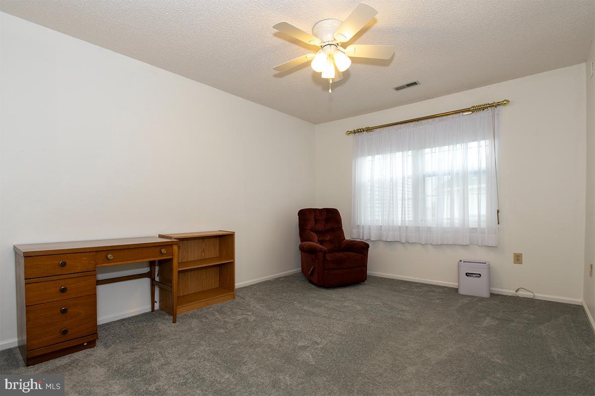 2000 Miller Avenue, Unit 26 Millville, NJ 08332 - Photo 19 of 25 a living room with furniture and a window
