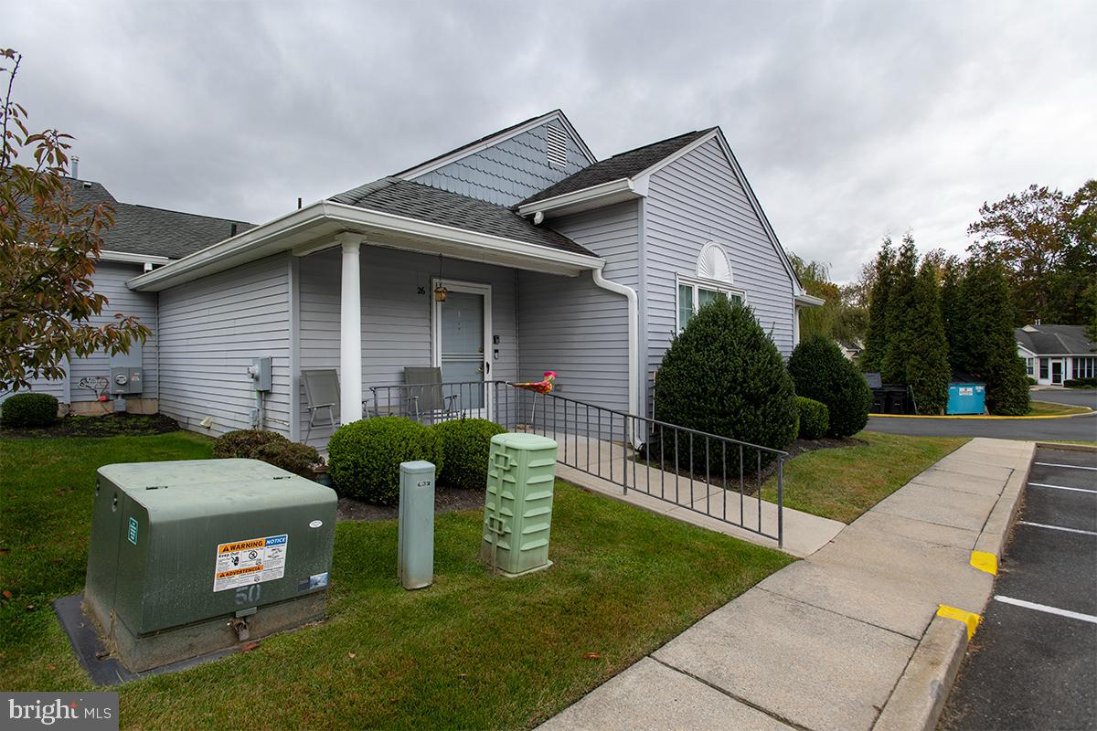 2000 Miller Avenue, Unit 26 Millville, NJ 08332 - Photo 2 of 25 a front view of a house with garden